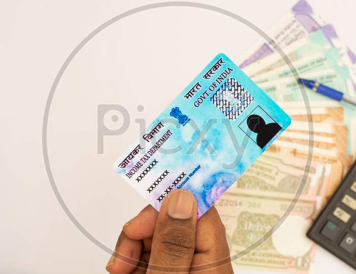 Income Tax Concept  With Indian Currency And Pan Card On Isolated Background