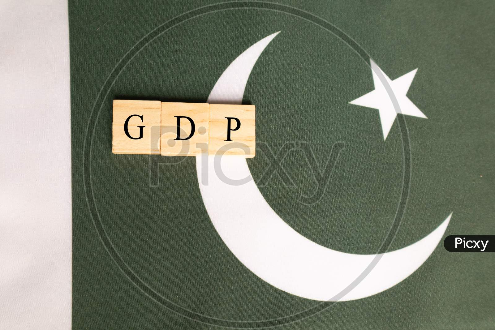 Gross Domestic Product Or Gdp Of Pakistan Concept On Pakistan Flag.