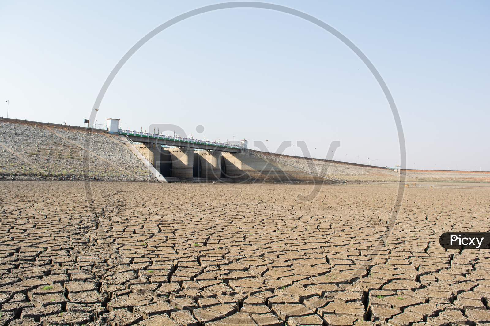 A Dried Up Empty Reservoir Or Dam During A Summer Heatwave, Low Rainfall And Drought In North Karnataka,India