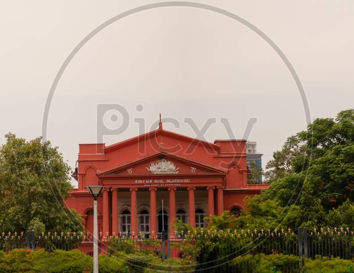 Bangalore India - June 3, 2019: Panoramic View Of Karnataka High Court Covered With Green Trees.