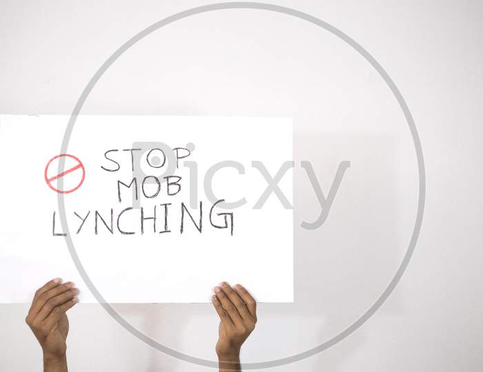 Hands With Placard Showing Of Stop Mob Lynching On Isolated Background.