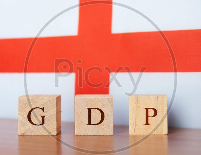 Concept Of Gross Domestic Product Or Gdp Of England, Gdp In Wooden Block Letter with England Flag.