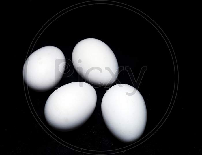 Chicken Eggs In Black Background
