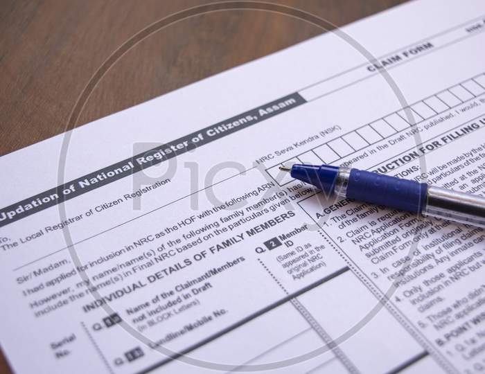 Concept Of Filling Nrc Or National Register Of Citizens Form With Pen On Table