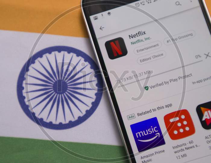 Netflix App Downloading On Mobile With Indian Flag As Background.