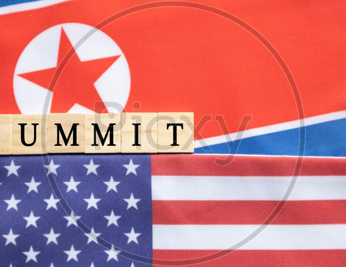 Concept Of Bilateral Relations Of Usa And North Korea Showing With Flag And Summit In Wooden Block Letters