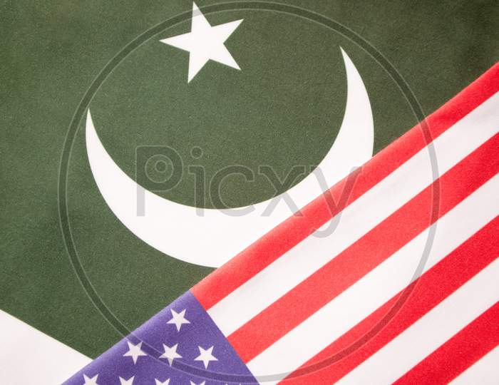 Concept Of Bilateral Relationship Between Two Countries Showing With Two Flags: United States Of America And Pakistan.