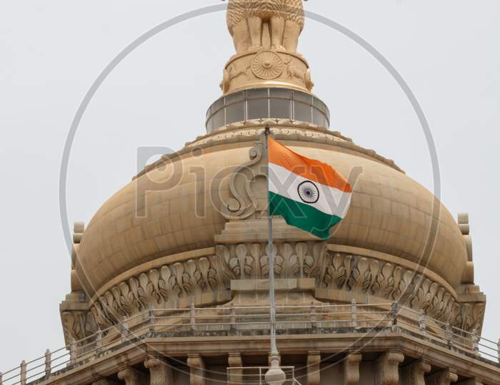 Closeup Of Indian Flag Waving On The Dome Of Vidhana Soudha At Bangaluru, India