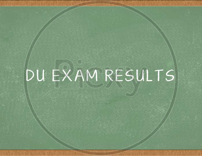 Du Exam Results Written On Green Chalkboard.