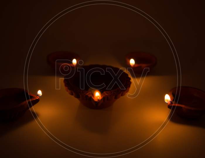 Diwali Terracotta Diyas On Dark Background Which Are Used Lighting Up The House During Diwali Times.