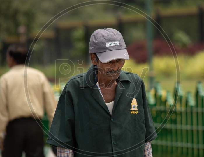 Bangalore, Karnataka India-June 04 2019 : Municipal Corporation Bangalore Or Bbmp Worker With Hat Or Cap Near Vidhana Coudha.
