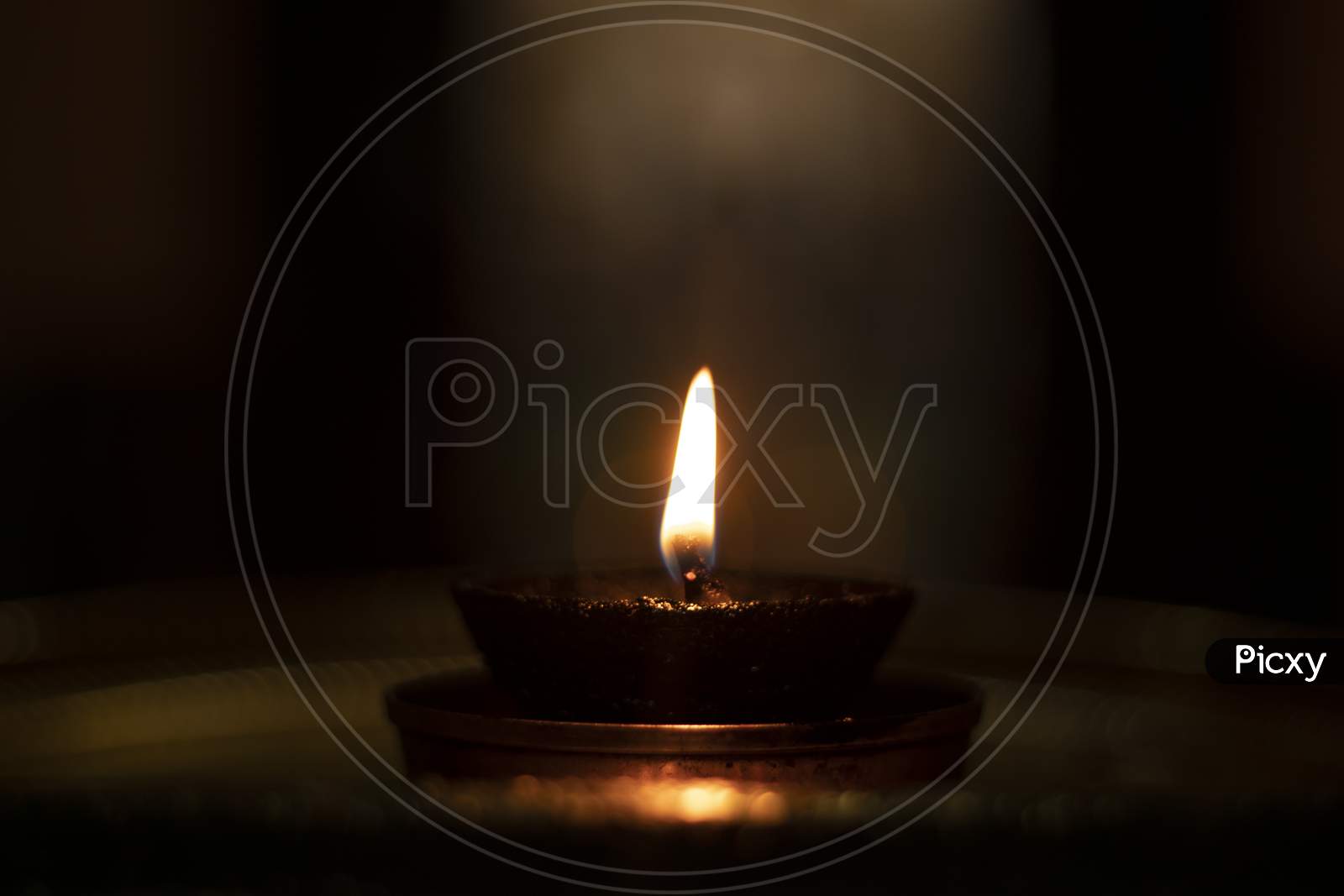 Concept Of Light In Darkness Showing With Diwali Terracotta Diya Ot Light Lamp In Dark.