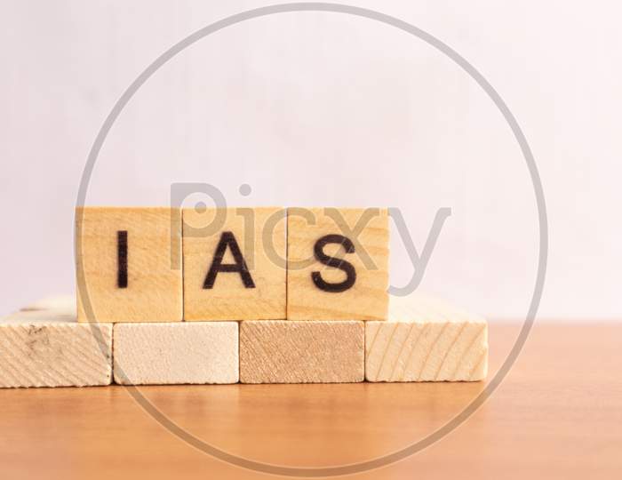 Ias Or Indian Administration Service In Wooden Block Letters On Isolated Background