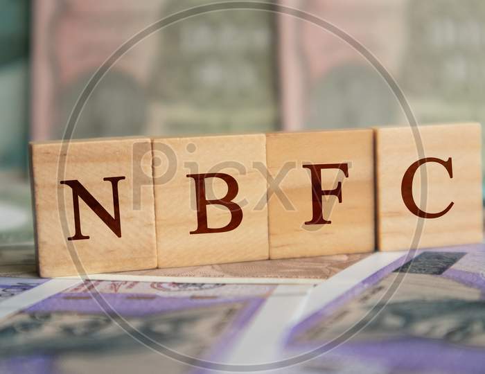 Nbfc In Wooden Block Letters On Indian Currency