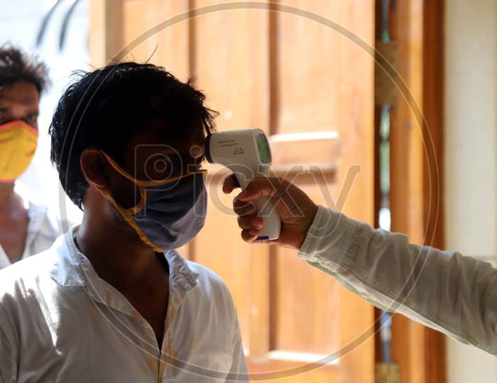 A Paramedic conducts Thermal Scanning for Allahabad High Court Advocates And Employees After Allahabad High Court Reopening , In Prayagraj, June 8, 2020.