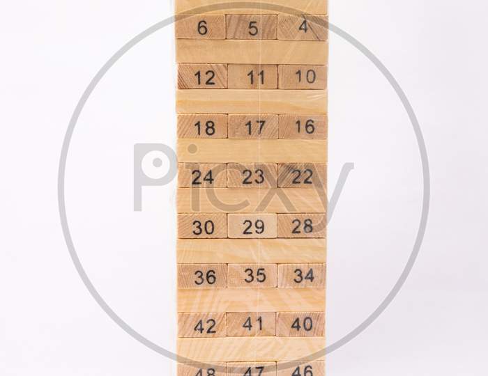 New Blocks Of Wood For Playing Balance Puzzle Game,Packed In Plastic Cover On White Background