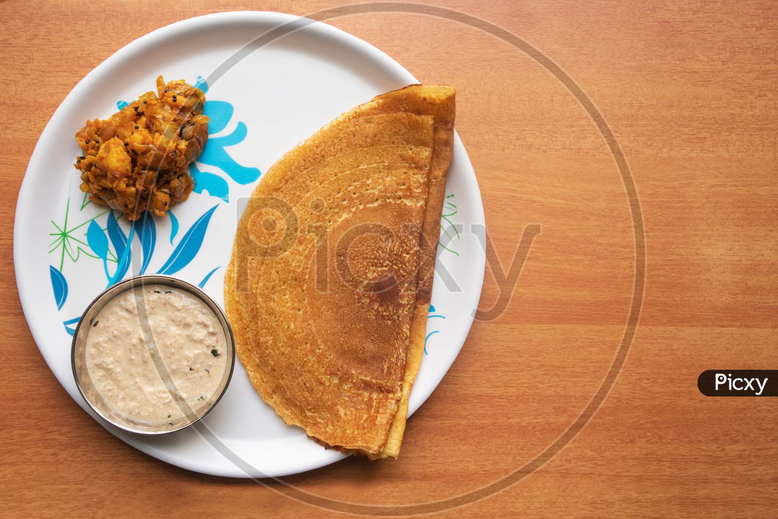 Maida Dosa With Coconut Chutney And Potato Or Aloo Currey In Plate
