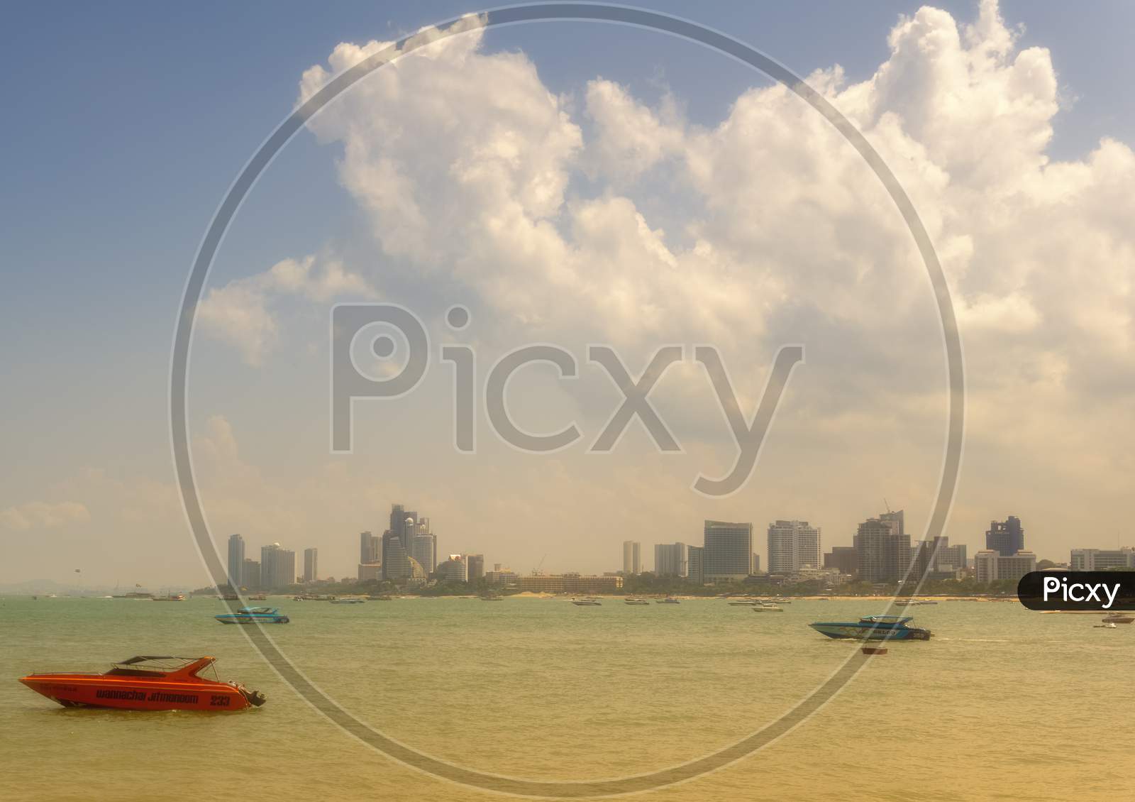 Pattaya,Thailand - April 20,2018: The Beach Tourists Relax And Swim There And Rent Boats For Trips.Some Thai People Sell Souvenirs,Food And Drinks To Them.