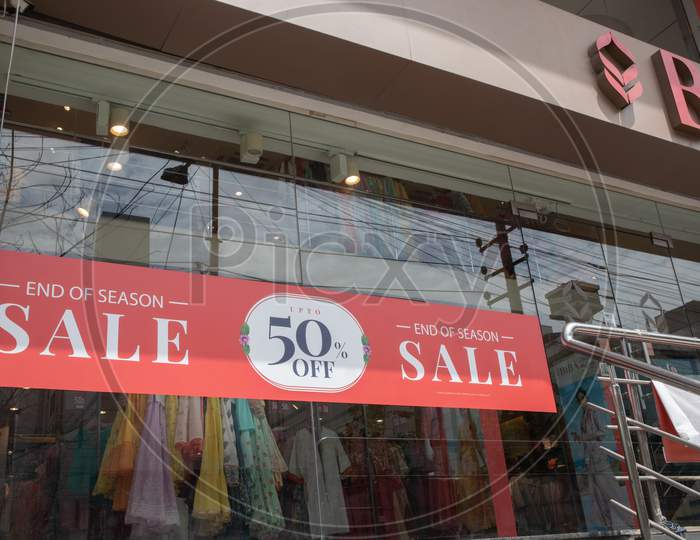 Bengaluru, India June 17, 2019 : Window Display Of Red Sale Board Showing Of End Of Season Sale With Upto 50 Percent Off Outside The Shop At Bengaluru, India