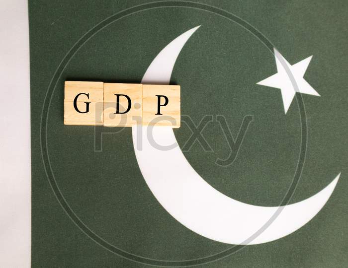 Gross Domestic Product Or Gdp Of Pakistan Concept On Pakistan Flag.