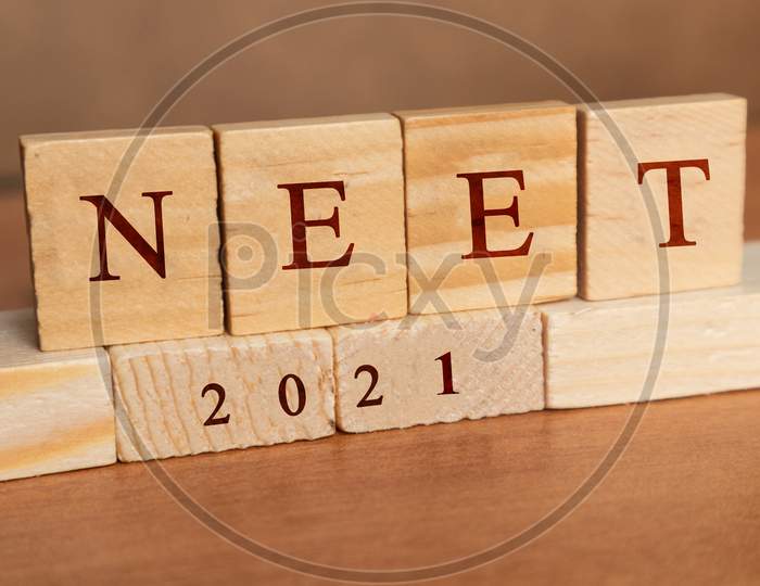 Neet Or National Eligibility And Entrance Test Results In Wooden Block Letters.