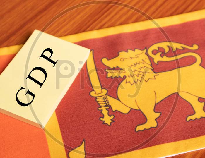 The Word Gross Domestic Product Or Gdp Written In Paper On Sri Lanka Flag