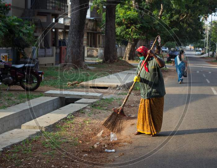 Health worker cleaning the streets at Mysore