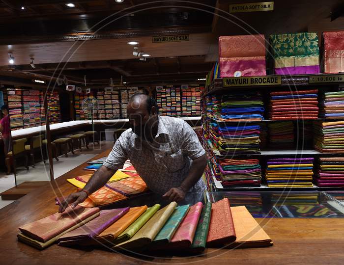 A Salesman Arranges Saree At A Showroom After Reopening in Chennai, Tamil Nadu