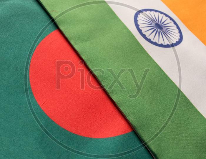 Bangladesh And Indian Flags Placed On Table