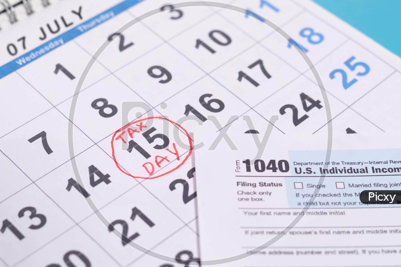 July 15Th Marked As Tax Day On Calendar With Tax From - Concept Of File Tax Form Before Deadline July 15Th