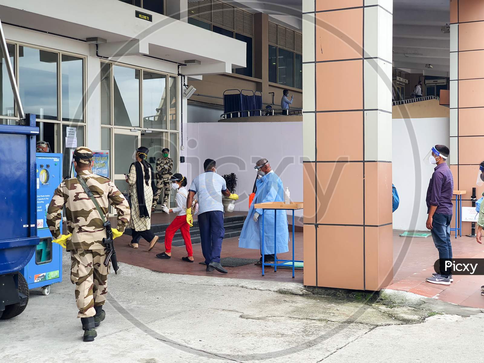 6Th June 2020- Bagdogra Airport,Siliguri, West Bengal, India-Passengers In Protective Gear Being Sanitized On Arrival By Airport Staff At Bagdogra Airport