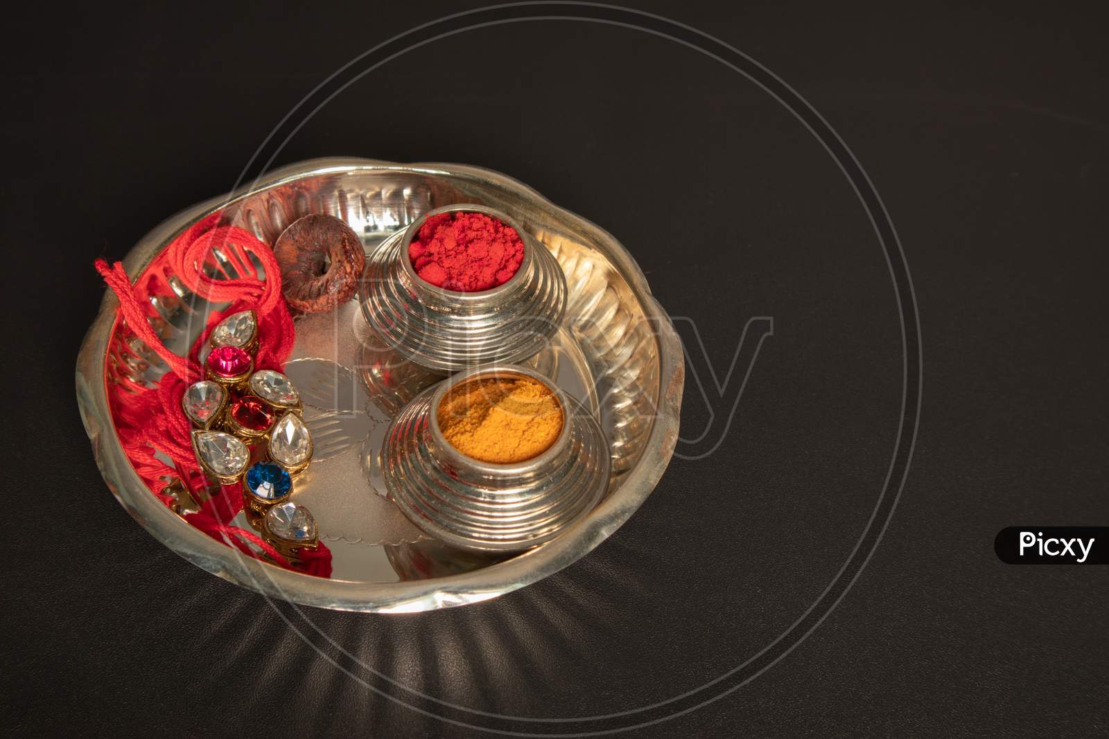 Raksha Bandhan Raakhi Or Rakhi With Pooja Plate A Traditional Hindu Festival Or Ceremony On Black Background,