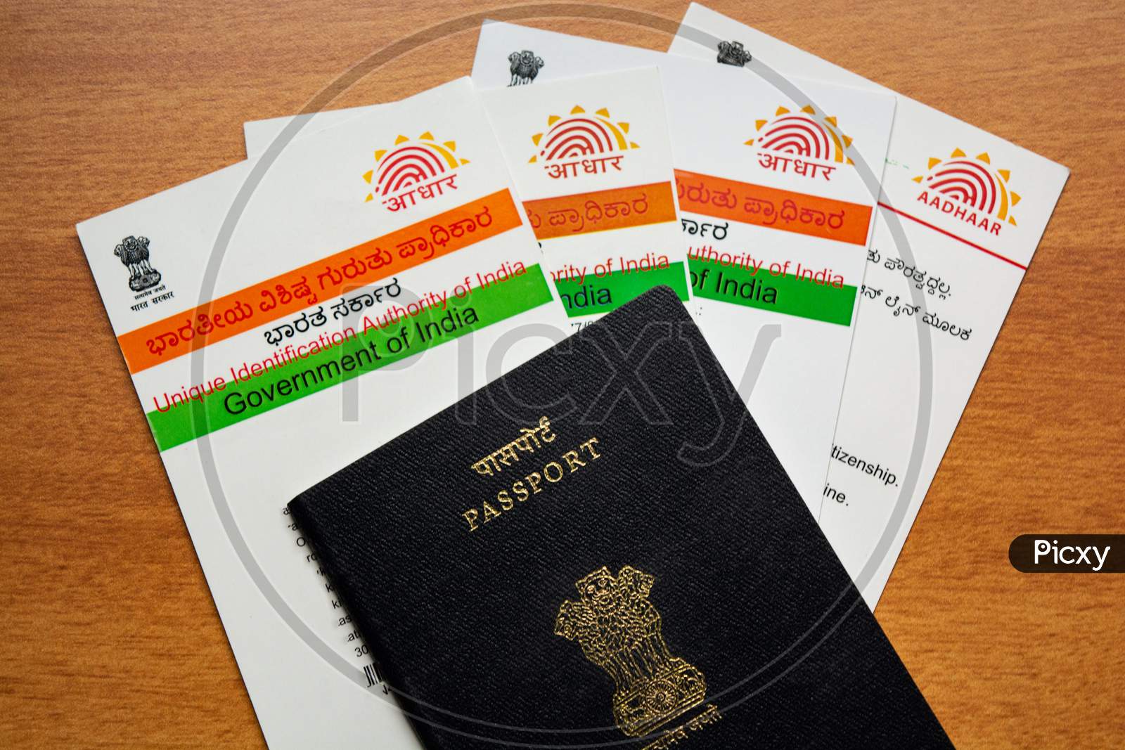 Aadhaar Card And Passport Which Is Issued By Government Of India As An Identity Card To Travel Foreign.