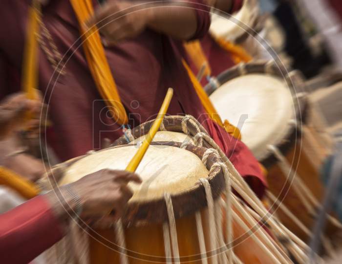 Close up shot of a People playing Drum Music Equipment with Hand