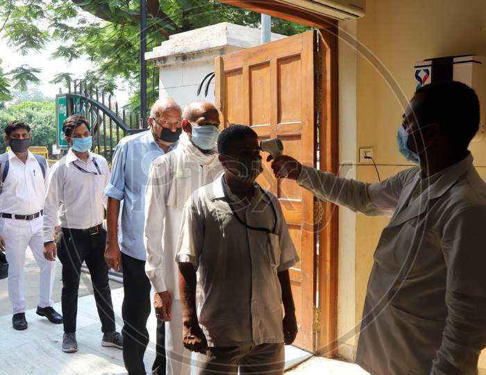 A Paramedic Conducts Thermal Scanning for Allahabad High Court Advocates And Employees after its Reopening, In Prayagraj, June 8, 2020.