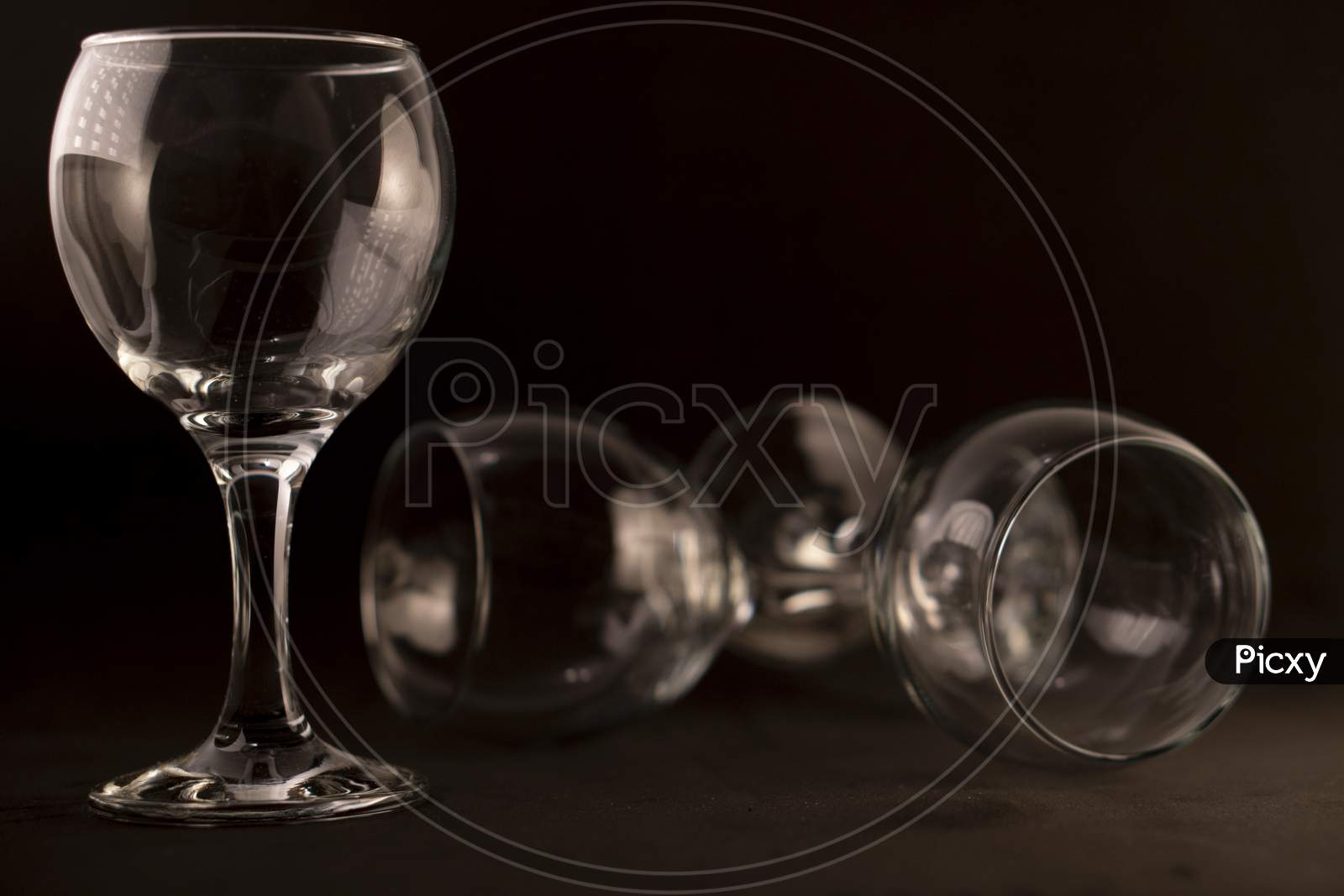 Picture of empty wine glasses against a black background