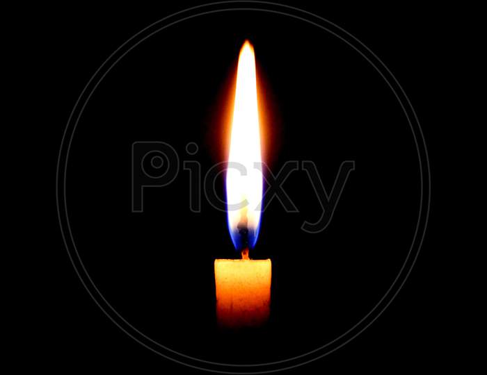 A Burning Candle breaks dark