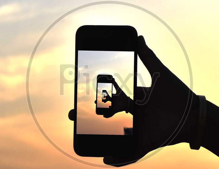 phone in hand silhouette