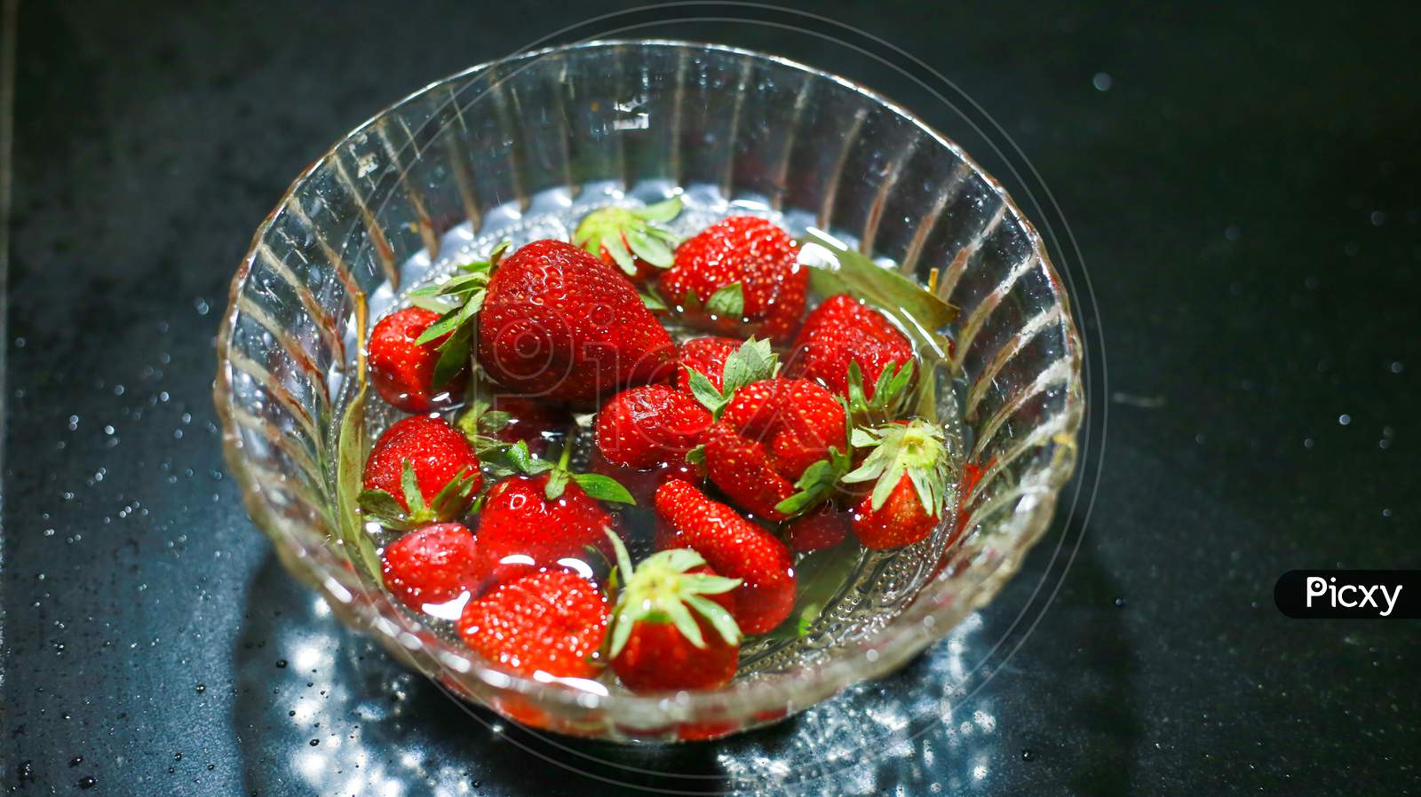 Group Of Strawberry In Glass Bowl, Red Colour Fruit, Strawberry In Dark Background