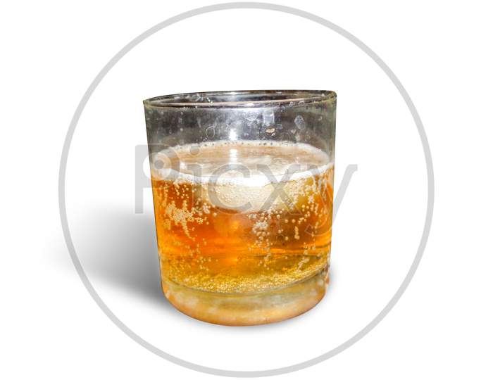 Whiskey in the glass isolated on white background