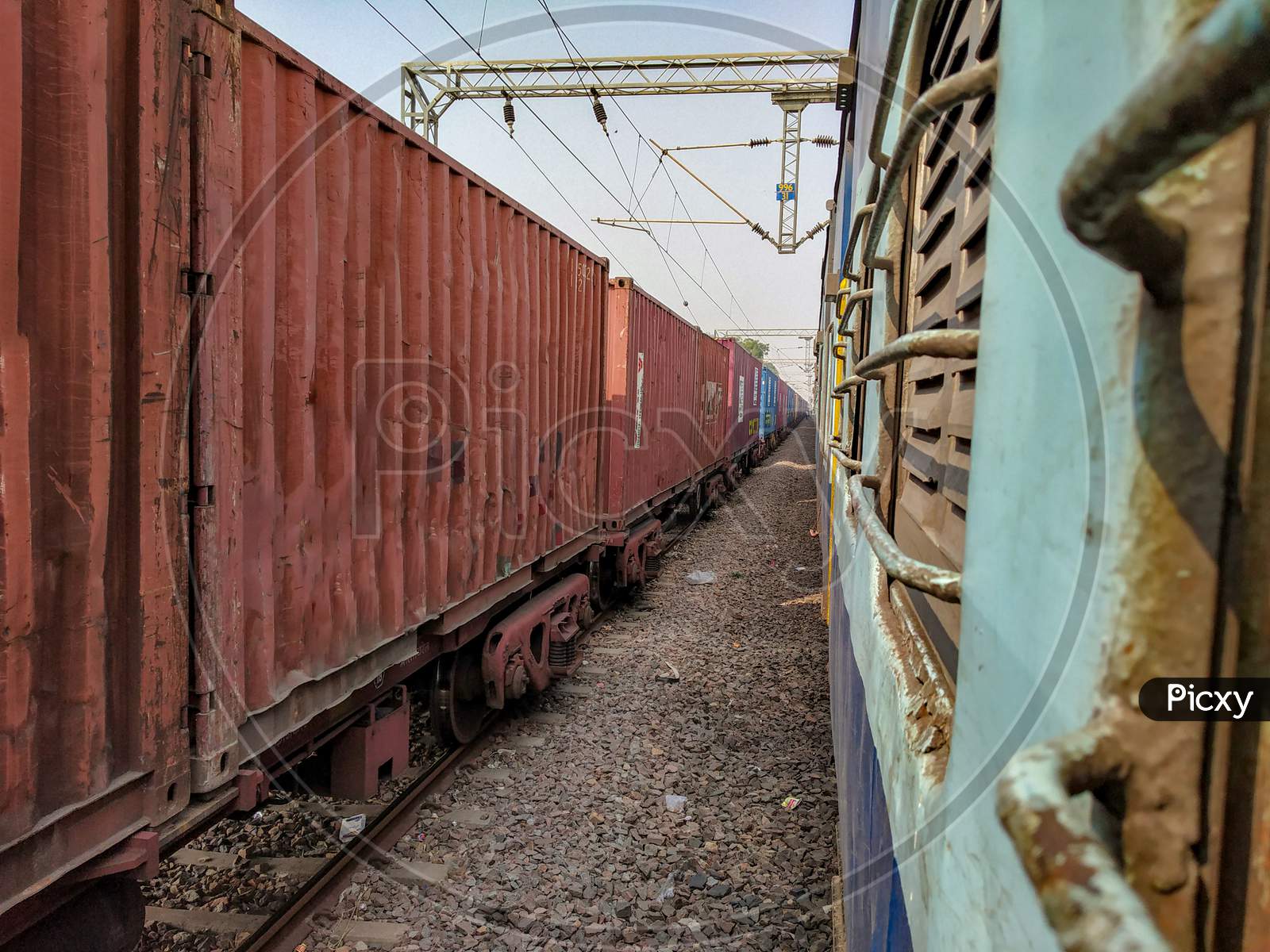 Between the Indian railway cargo train and passenger