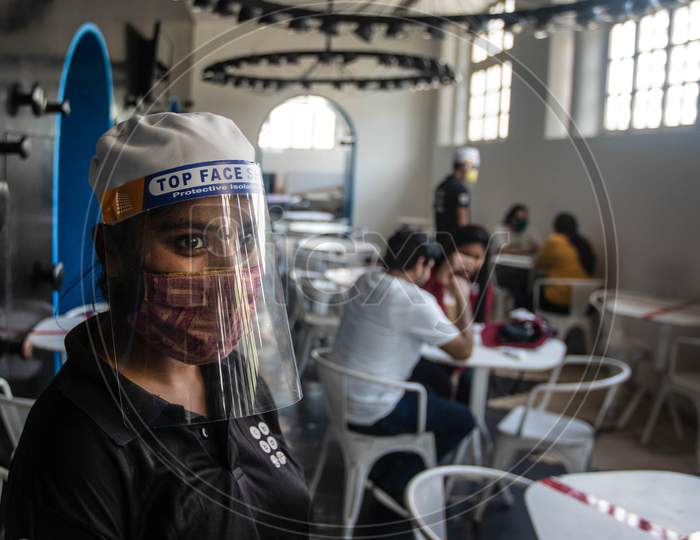People Wearing Masks and face shields Are Seen At The Restaurant As India Eases Lockdown Restrictions That Were Imposed To Slow The Spread Of The Coronavirus Disease (Covid-19), In New Delhi, India, June 8, 2020.