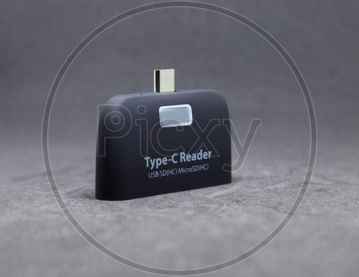 Type C Reader USB 3.1 Multi function adapter with grey background.
