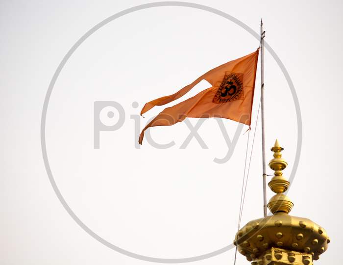Orange Hindu Flag Flutters In The Wind At Mantralaya Above The Temple.