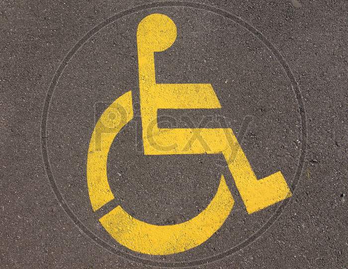 Disable Handicap Parking Sign On Asphalt