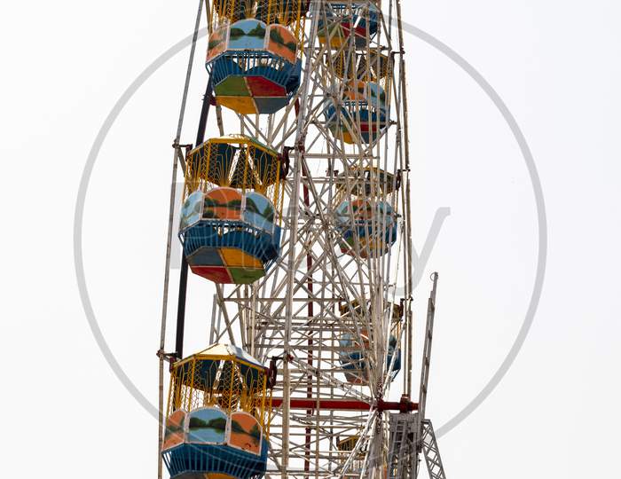 Ferris Wheel In Amusement Park Isolated On White Background