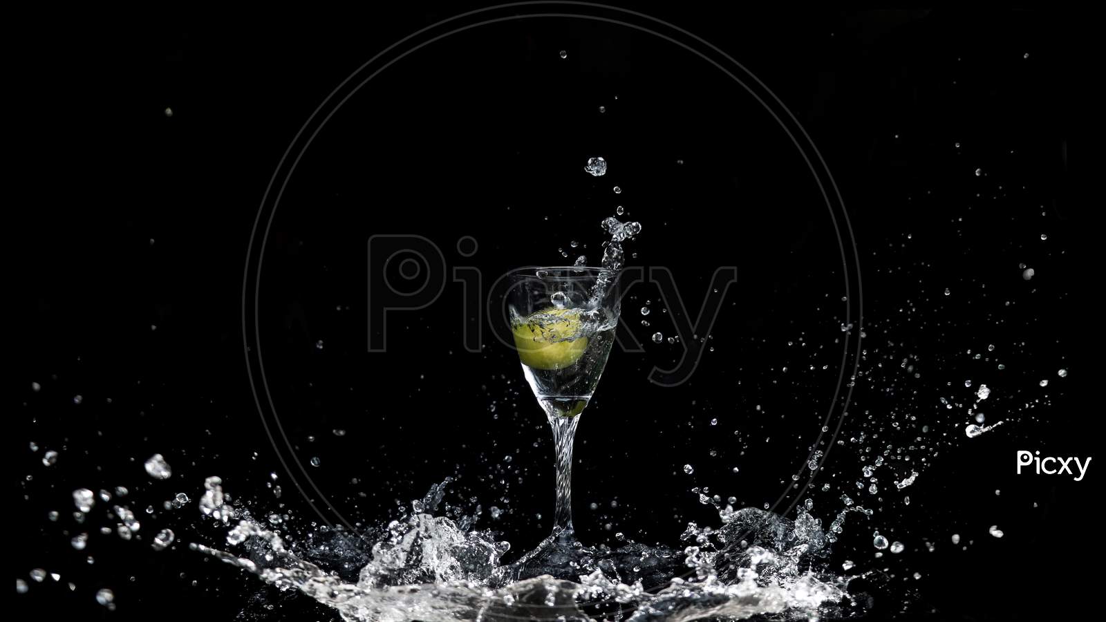 Big Splash Of Water Into Wine Glass