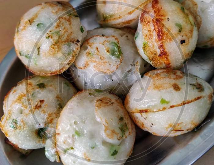 Close Up Of Plate Full Of Paddu. Selective Focus.