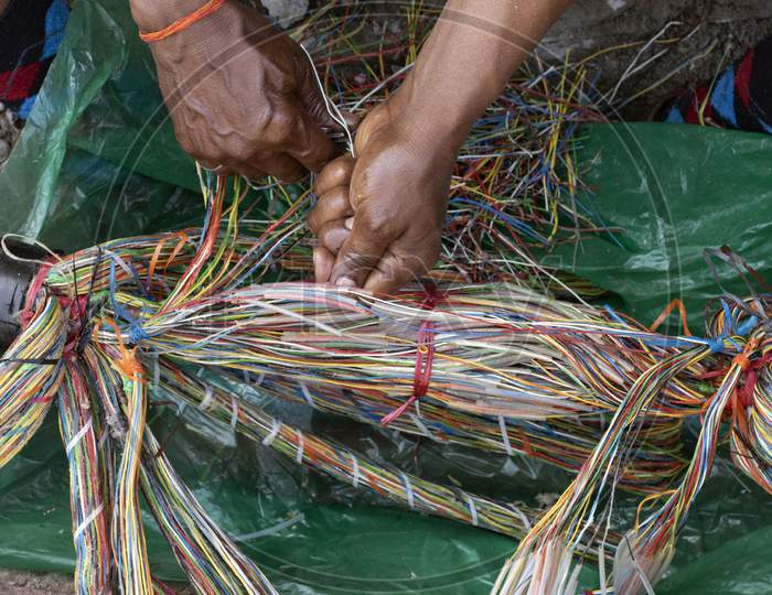 Technician Repairing An Underground Telephone Line Multicolored Wires