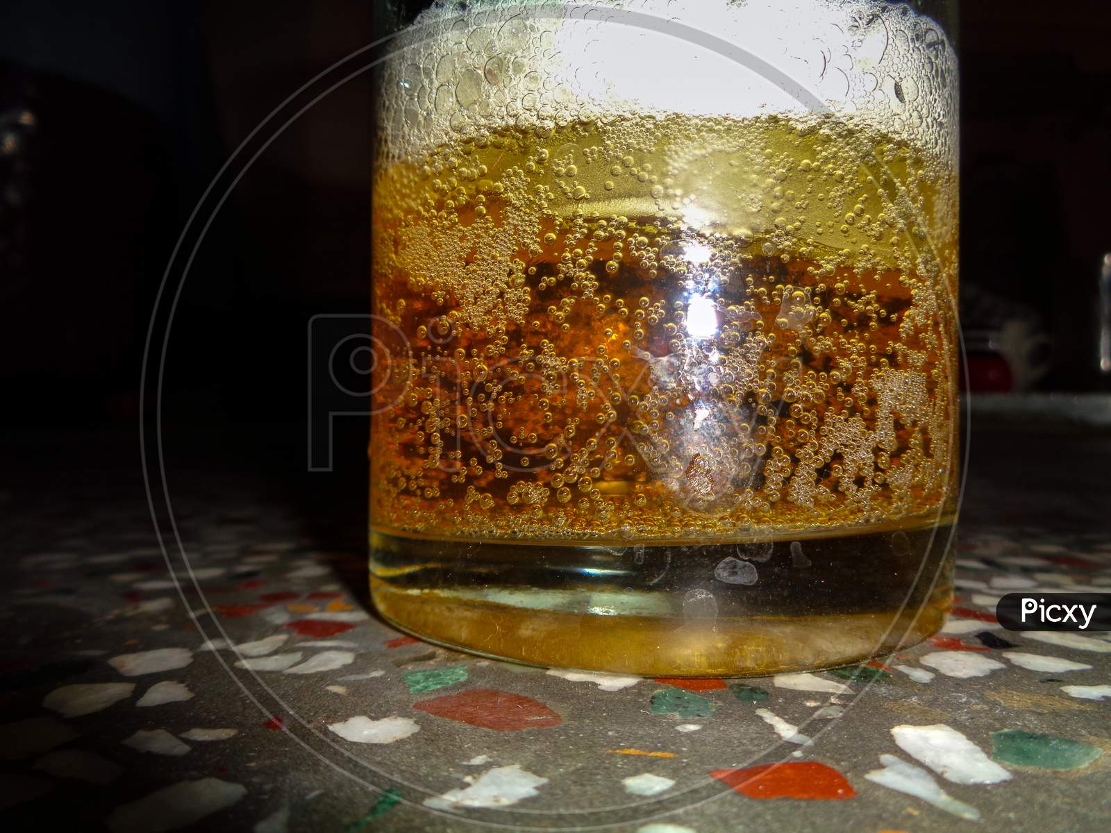 Close-up view of the beer liquid bubble in the beer mug